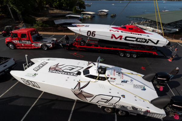 Powerboat on a power lift on the back of a semi